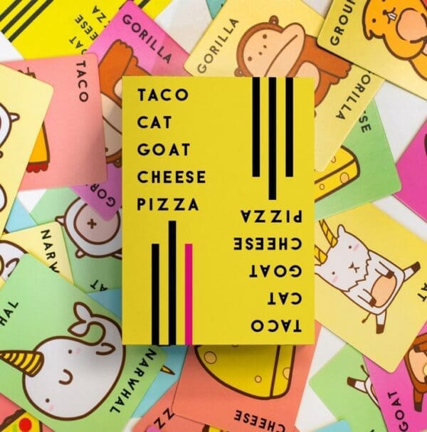Taco cat goat cheese pizza tuck box on a bed of cards